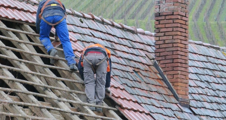 men installing roof
